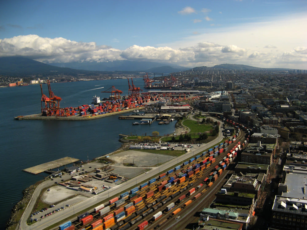 Aerial view of the Port of Vancouver container terminal, gantry cranes, and CN/CP intermodal rail yard on Burrard Inlet